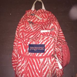 Orange salmon color big backpack.